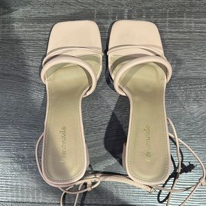 Women heels worn once for an event. nude color , ties at ankle
